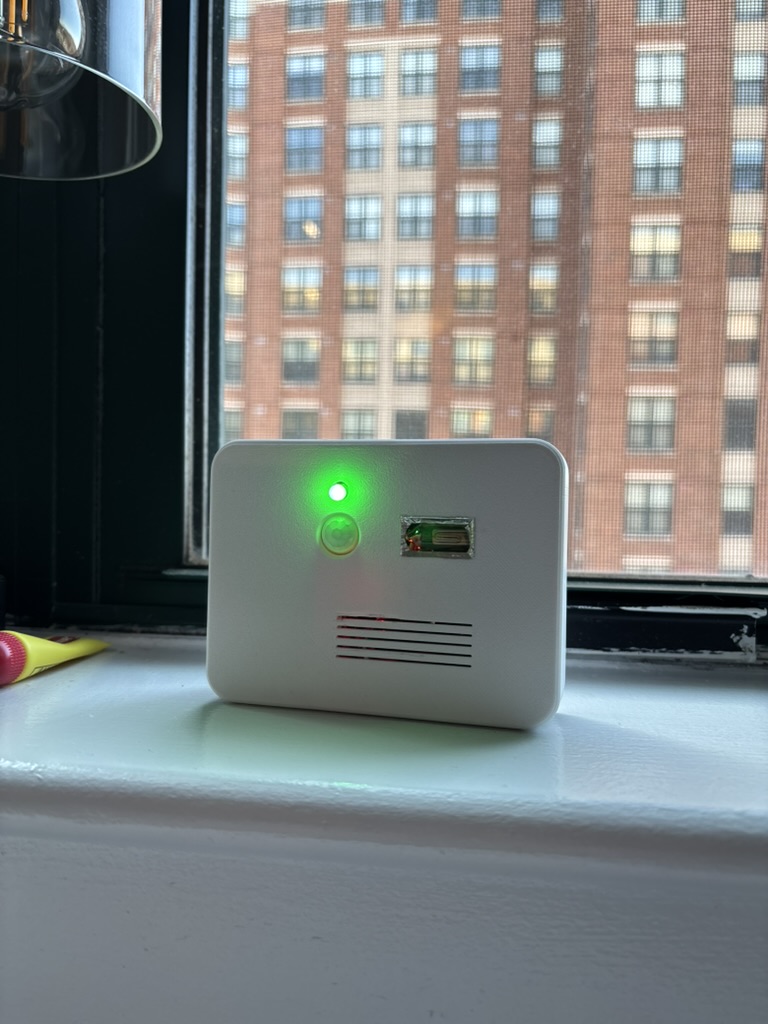 BlazeBlock prototype on a windowsill with its green indicator light on