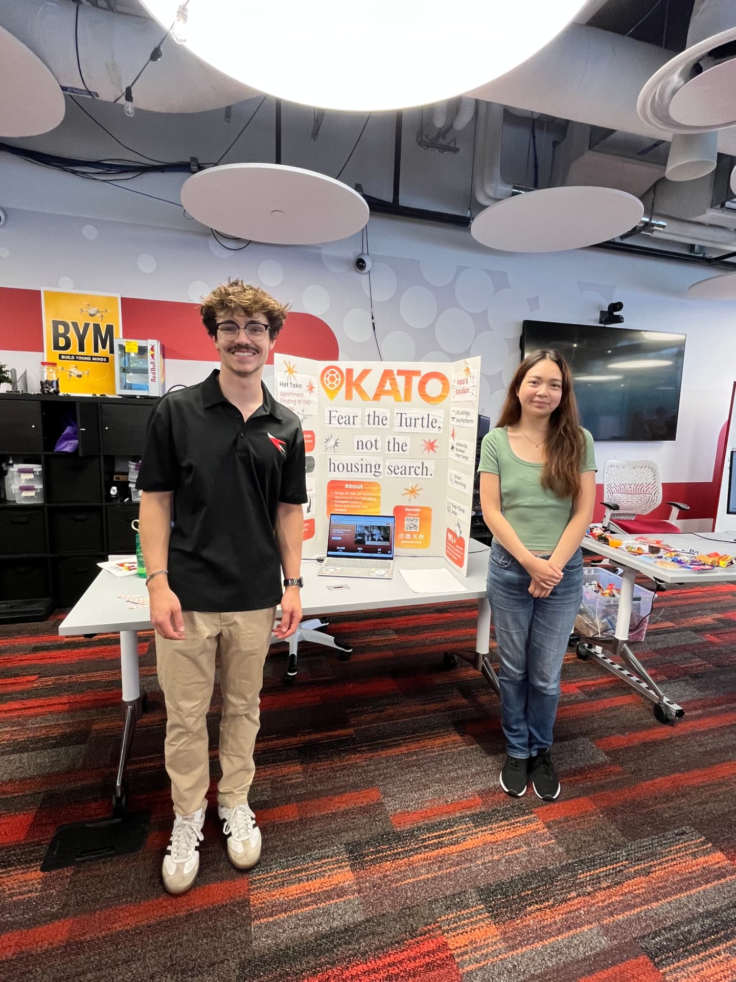 The Kato team beside their showcase display