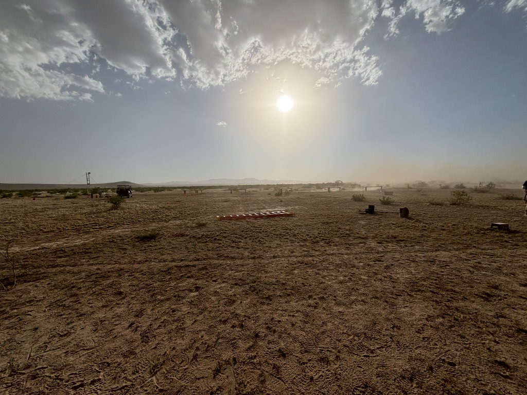 The launch field at Spaceport America Cup with a red rocket on the ground
